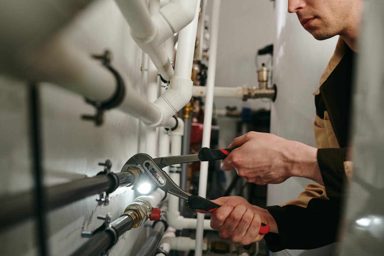 Plumbers maintaining commercial plumbing pipes in Rancho Cucamonga