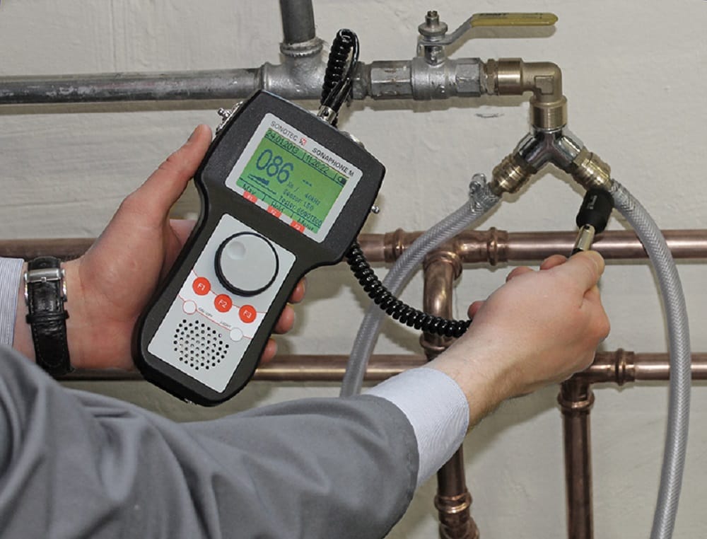 Plumber testing pipes with electronic leak detection equipment in Rancho Cucamonga