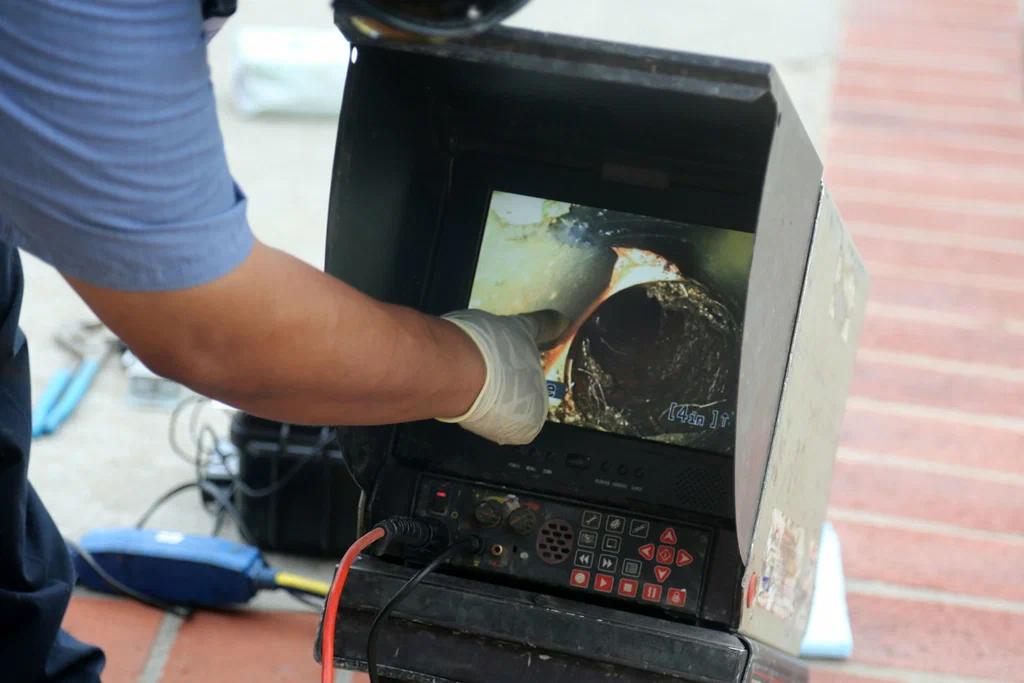 Technician viewing a drain inspection camera in Rancho Cucamonga